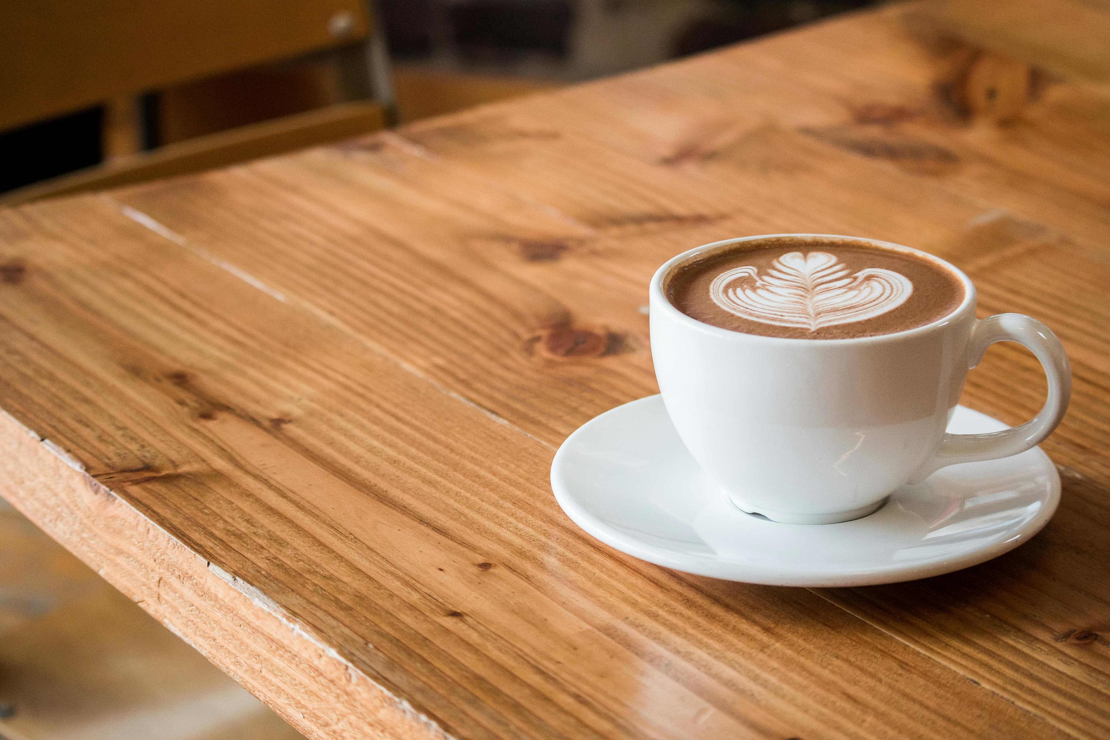 Fresh coffee and breakfast on a café table